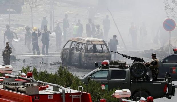 Members of security forces stand at the site of an attack near the Afghan parliament in Kabul, Afghanistan, on June 22, 2015. (Reuters/Ahmad Masood)