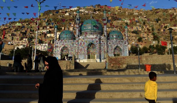 An Afghan woman leaves the Karte Sakhi Shrine in Kabul on May 31, 2015. (AFP Photo/Farshad Usyan)