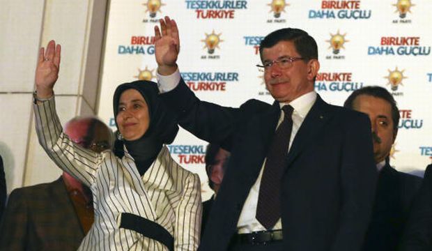 Turkey's Prime Minister and leader of ruling Justice and Development Party Ahmet Davutoglu and his wife Sare Davutoglu wave to supporters from the balcony of his party in Ankara, Turkey, late Sunday, June 7, 2015. (AP)
