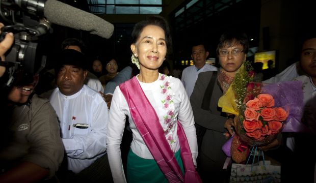 Myanmar's opposition leader Aung San Suu Kyi arrives at Yangon International Airport to depart for China on June 10, 2015, in Yangon, Myanmar. (AP Photo/Khin Maung Win)