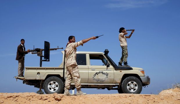 Libya Dawn fighters look at Islamic State of Iraq and Syria (ISIS) militant positions near Sirte on March 19, 2015. (Reuters/Goran Tomasevic)