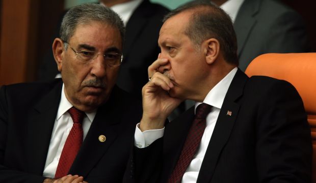 Turkey's President Recep Tayyip Erdoğan (R) listens to a lawmaker as newly elected legislators take their oaths during the Turkish parliaments first session in Ankara, Turkey, on June 23, 2015. (AP Photo/Burhan Ozbilici)