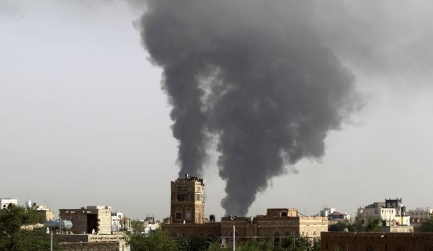 Smoke billows following airstrikes by the Saudi-led coalition on a weapons depot at a military airport, currently controlled by Yemeni Shi'ite Houthi rebels, on July 7, 2015 in the capital Sana'a. (AFP Photo/Mohammed Huwais)