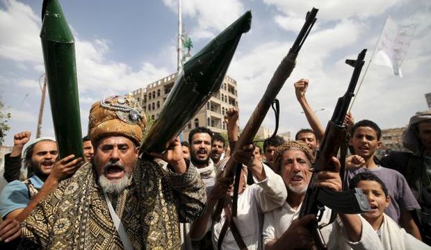 Houthi followers hold mock missiles and their rifles as they shout slogans during a demonstration against the United Nations in Sana’a, Yemen, on July 5, 2015. (Reuters/Mohamed Al-Sayaghi)