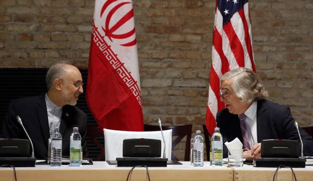 US Secretary of Energy Ernest Moniz and Head of the Iranian Atomic Energy Organization Ali Akbar Salehi (L) meet at a hotel in Vienna, during negotiations over Iran's nuclear program, on July 9, 2015. (Carlos Barria/Pool Photo via AP)