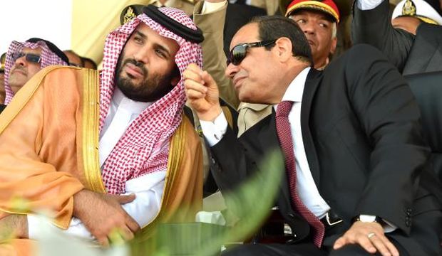 A handout picture provided by the Office of the Egyptian Presidency on July 30, 2015 shows Egyptian President Abdel-Fattah El-Sisi (R) speaking with Saudi Deputy Crown Prince and Minister of Defense Mohammed Bin Salman during a military academy graduation ceremony in the Egyptian capital, Cairo. (AFP Photo/Ahmed Fuad/HO/ Egyptian Presidency)