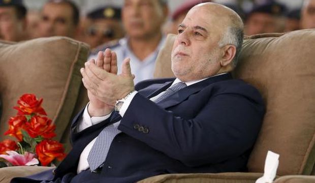 Iraq's Prime Minister Haidar Al-Abadi attends an official ceremony to receive four F-16 fighter jets from the US, at a military base in Balad, Iraq, on 20, 2015. (Reuters/Thaier Al-Sudani)