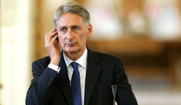 British Foreign Secretary Philip Hammond listens to a translation of a question in a joint press conference with Iranian Foreign Minister Mohammad Javad Zarif (unseen) in Tehran, Iran, August 23, 2015. (AP Photo/Ebrahim Noroozi) 