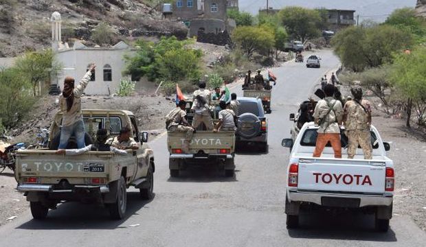 Yemeni fighters loyal to exiled President Abd Rabbuh Mansur Hadi drive in a street in the city of Al-Dalea, 174 miles (280 kilometers) south of the capital Sana’a, on August 30, 2015. (AFP Photo/Saleh Al-Obeidi)