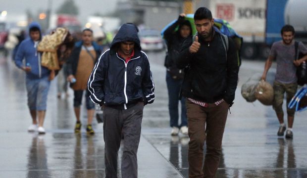 Migrants arrive at the border between Hungary and Austria on September 5, 2015. (AP Photo/Frank Augstein)