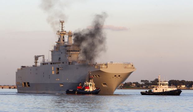 In this March 5, 2014 file photo, French-built warship BPC Vladivostock, designed to strengthen Russia's ability to deploy troops, tanks and helicopter gunships, leaves the Saint Nazaire's harbor, western France. (AP Photo/David Vincent, File)
