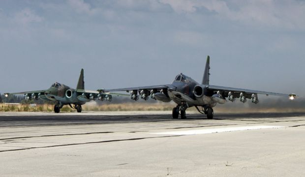In this photo made from the footage taken from Russian Defense Ministry official web site on Tuesday, October 6, 2015, two Russian SU-25 ground attack aircraft take off from an airbase Hmeimim in Syria. (Russian Defense Ministry Press Service via AP)