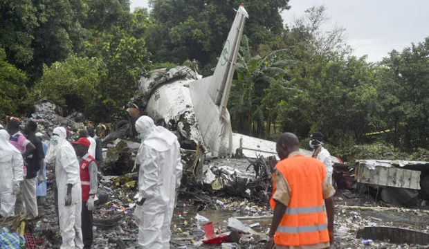 Responders pick through the wreckage of a cargo plane which crashed in Juba, South Sudan, on November 4, 2015. (AP Photo/Jason Patinkin)