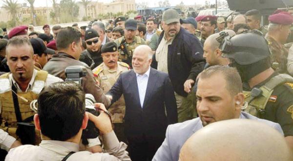 The Iraqi Prime Minister Haider Al-Abadi during his visit to Ramadi yesterday (AP)