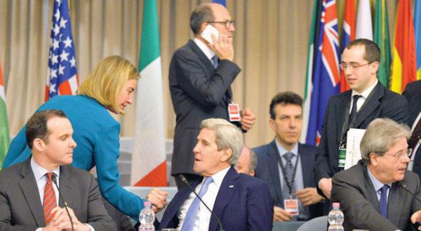 European Union High Representative for Foreign Affairs and Security Policy Federica Mogherini greets US Secretary of State John Kerry before an anti-ISIS summit in Rome yesterday (AFP) 