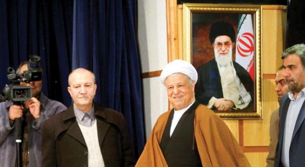 The chairman of the Expediency Discernment Council of Iran Ali Akbar Hashemi Rafsanjani in a Ministry of Interior building submitting his candidacy for the elections in December of last year (AP)