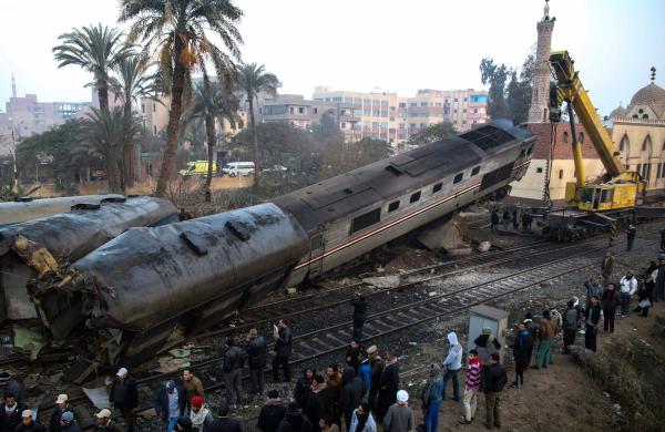 A general view shows the site where a train crashed near Beni Suef, south of the capital Cairo, on February 11, 2016. At least 70 people were injured when the passenger train derailed and two of its cars overturned (AFP)