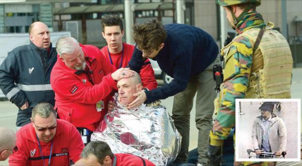 A victim receives first aid at Maelbeek metro station in downtown Brussels yesterday (AFP). Inset: one of the suspects in the attacks (AFP)