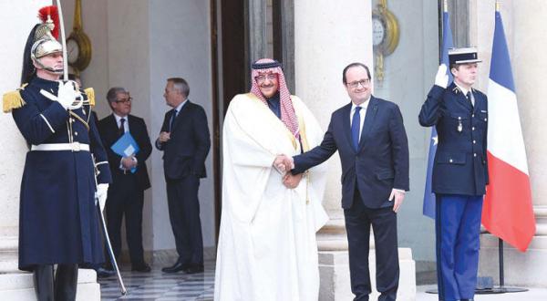 President Hollande receives Prince Mohammed bin Nayef in the courtyard of the Elysee Palace in Paris yesterday (SPA)