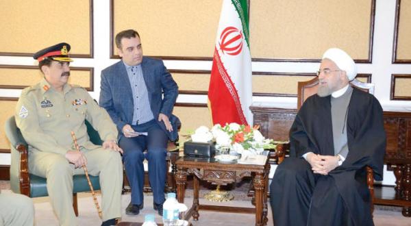 Iranian President meets Army General-Commander Raheel Sharif in Islamabad, March 26 A.F.P