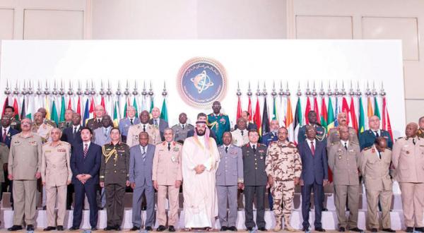 Saudi Defence Minister and Deputy Crown Prince, Mohammad Bin Salman (C-R), poses with the chiefs of staff of the Saudi-led Islamic Military Counter Terrorism Coalition during a meeting in the capital Riyadh on March 27
