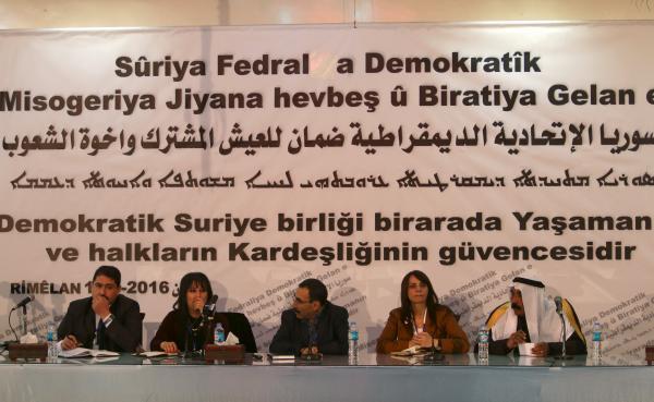 Bureau members of a preparatory conference to announce a federal system discuss a "Democratic Federal System for Rojava - Northern Syria" in the Kurdish-controlled town of Rmeilan, Hasaka province, Syria March 16, 2016. REUTERS/Rodi Said