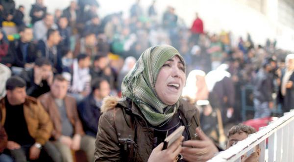 Palestinian lady crying while waiting access from Rafah border- Reuters