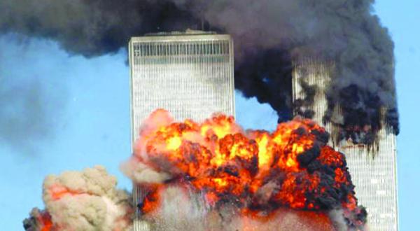 Smoke pours from the twin towers of the World Trade Center after they were hit by two hijacked airliners in a terrorist attack September 11, 2001