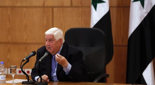 Syrian Foreign Minister Walid Al-Muallem speaks during a press conference (AFP)