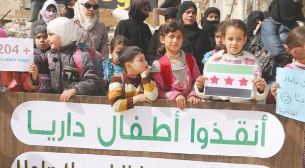 Women and children gathered in a campaign protest under the name (Save the Children of Darrayya),Asharq Al-Awsat