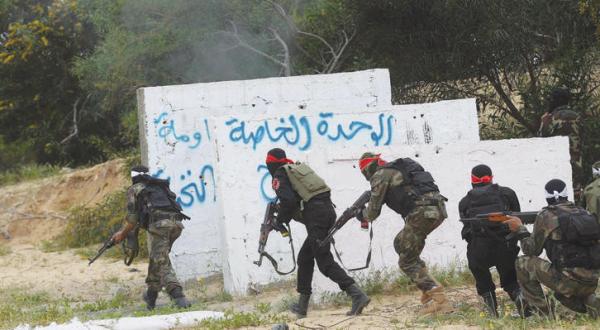 Armed fighters train in Gaza (AFP)