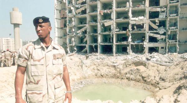 A file photo of a US Air Force personnel standing in front of the Khobar Towers bombing site in Dhahran, Saudi Arabia, in June 1996, which killed 19 Americans (Getty)