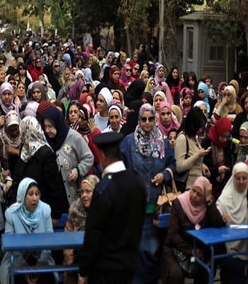 Egyptians narrowly back constitution, say rival camps