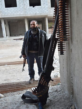 Syrian rebels fight for strategic town in Hama province