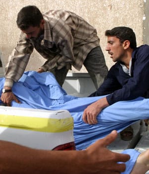 15 Iraqis killed by suicide bomber outside police headquarters