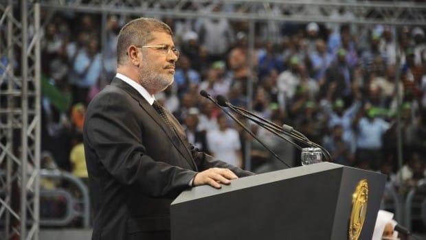 Mursi, Sunni scholars demand Hezbollah leave Syria