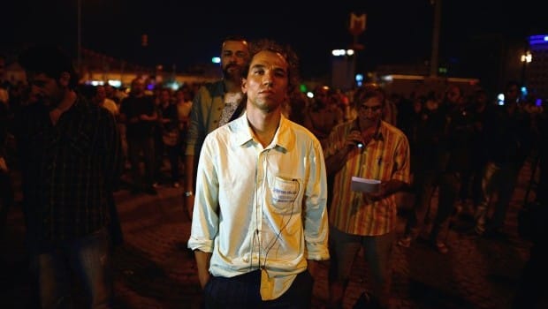 Dozens held in Turkey, silent protester goes viral