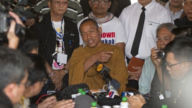 Thai election body urges vote delay, army stays neutral