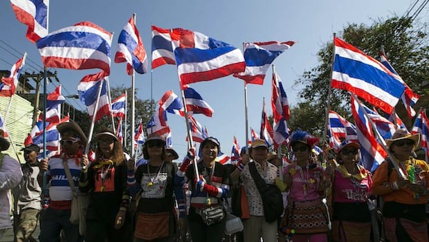 Thai protesters target ministries, threaten stock exchange