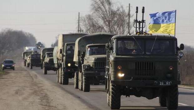 Merkel raps Putin as Russian forces tighten grip on Crimea