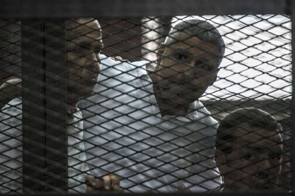 Egypt sentences three Al-Jazeera reporters to seven years