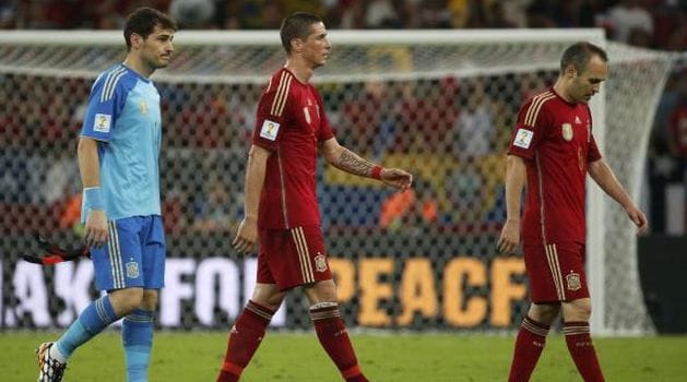 Champions Spain out of World Cup, Dutch march on