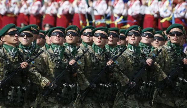 Defiant Ukraine turns on military display as war rumbles on in the east