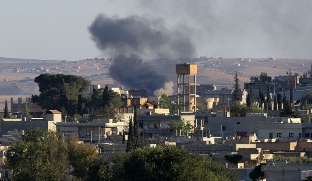 ISIS presses assault on Syrian border town, Kurds warn Turkey