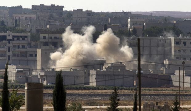 Kurds battle Islamist militants closing in on Syrian town