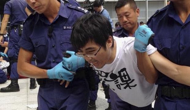 Hong Kong warns protesters not to return after clashes close government HQ