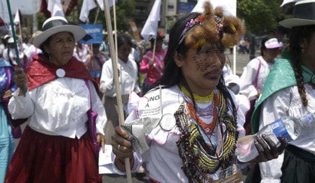 In overtime, UN climate talks head for watered-down deal in Lima