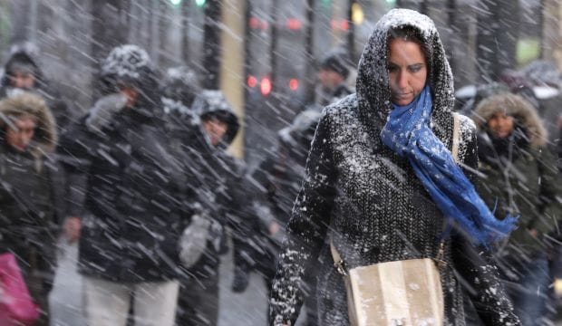 Millions hunker down as US snowstorm totals downgraded