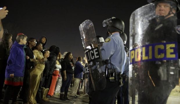 Two officers shot outside Ferguson police HQ after chief quits