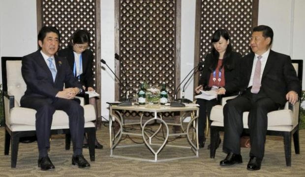 Japan PM Abe meets China’s Xi in Indonesia